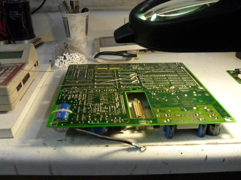 Can I wash an unplugged circuit board in soap and water to clean it
